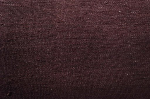 Backside of handmade New Modern Design rug showing knot structure and weave density