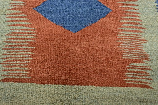 Backside of handmade New Modern Design rug showing knot structure and weave density