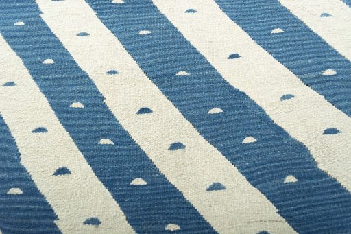Backside of handmade New Modern Design rug showing knot structure and weave density