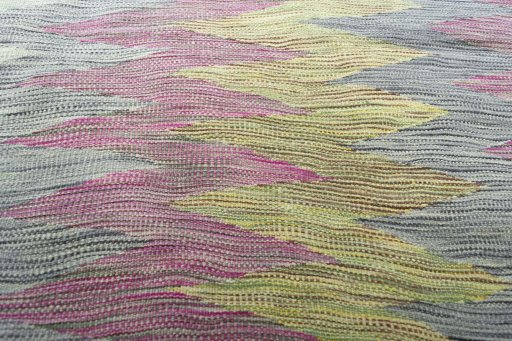 Backside of handmade New Modern Design rug showing knot structure and weave density
