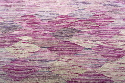 Backside of handmade New Modern Design rug showing knot structure and weave density
