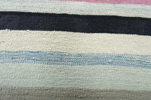 Backside of handmade New Modern Design rug showing knot structure and weave density