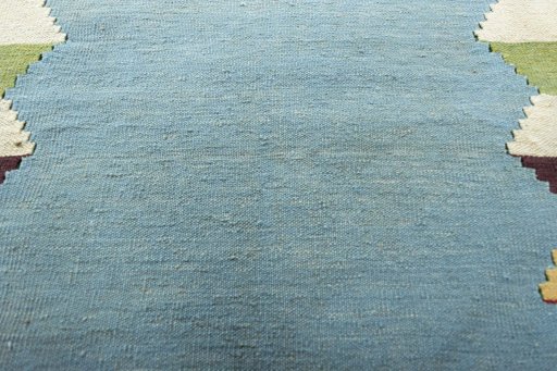 Backside of handmade New Modern Design rug showing knot structure and weave density