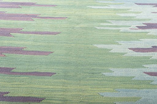 Backside of handmade New Modern Design rug showing knot structure and weave density