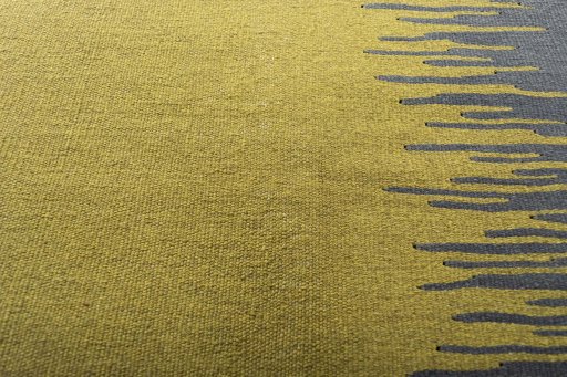 Backside of handmade New Modern Design rug showing knot structure and weave density
