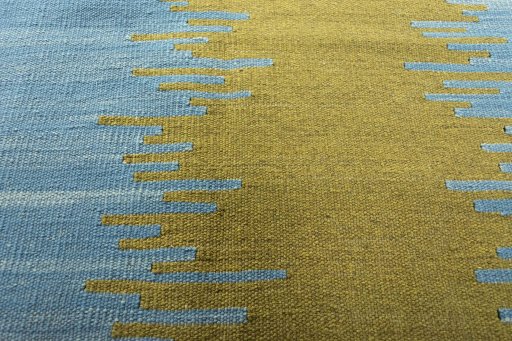 Backside of handmade New Modern Design rug showing knot structure and weave density