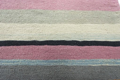 Backside of handmade New Modern Design rug showing knot structure and weave density