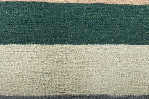 Backside of handmade New Modern Design rug showing knot structure and weave density