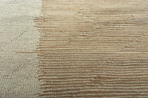 Backside of handmade New Modern Design rug showing knot structure and weave density