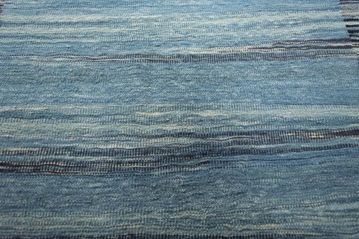Backside of handmade New Modern Design rug showing knot structure and weave density