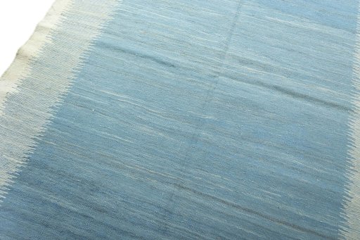 Backside of handmade New Modern Design rug showing knot structure and weave density