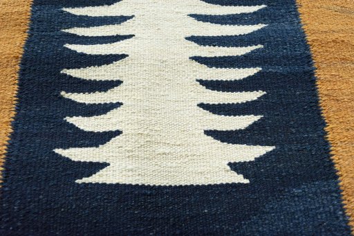 Backside of handmade New Modern Design rug showing knot structure and weave density