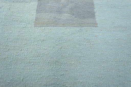 Backside of handmade New Modern Design rug showing knot structure and weave density