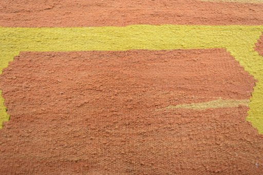 Backside of handmade New Modern Design rug showing knot structure and weave density