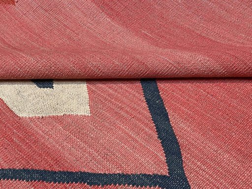 Backside of handmade New Modern Design rug showing knot structure and weave density