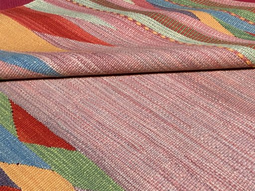 Backside of handmade New Modern Design rug showing knot structure and weave density