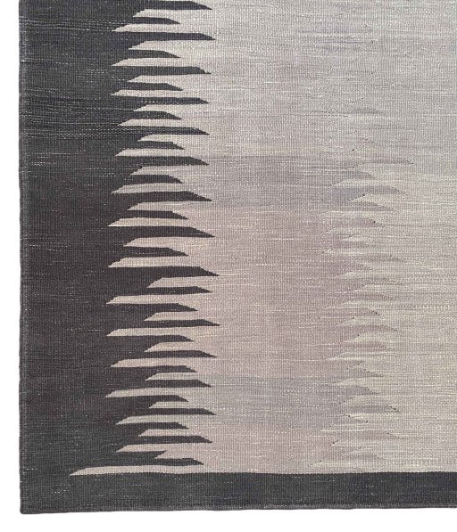Backside of handmade New Modern Design rug showing knot structure and weave density