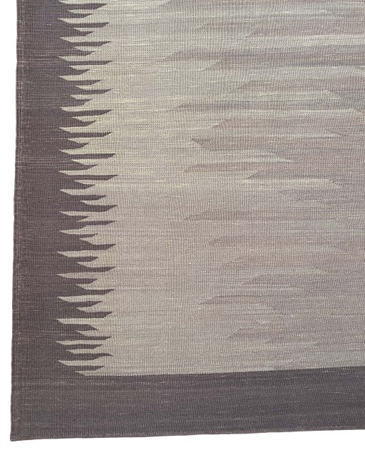 Backside of handmade New Modern Design rug showing knot structure and weave density