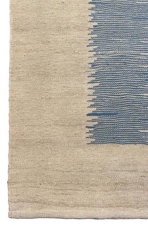 Backside of handmade New Modern Design rug showing knot structure and weave density
