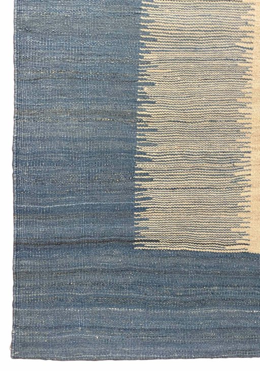 Backside of handmade New Modern Design rug showing knot structure and weave density