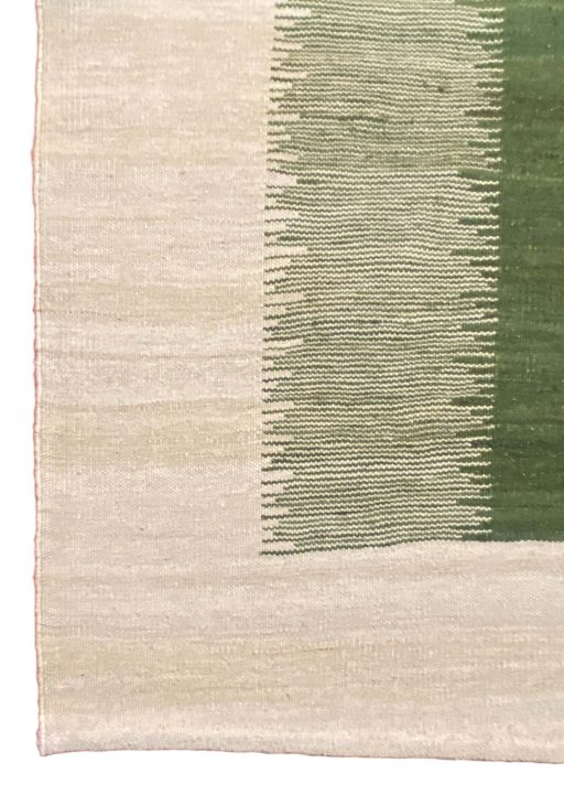 Backside of handmade New Modern Design rug showing knot structure and weave density