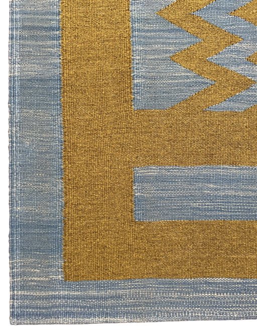 Backside of handmade New Modern Design rug showing knot structure and weave density