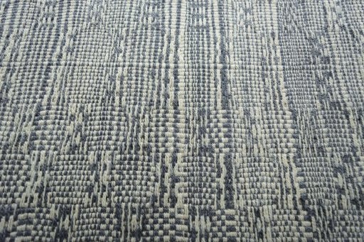 Backside of handmade New Modern Design rug showing knot structure and weave density