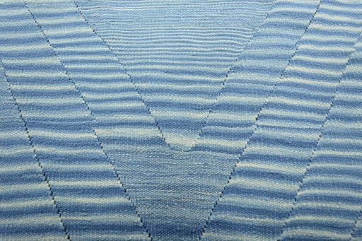 Backside of handmade New Modern Design rug showing knot structure and weave density