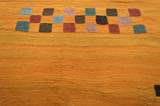 Backside of handmade New Modern Design rug showing knot structure and weave density