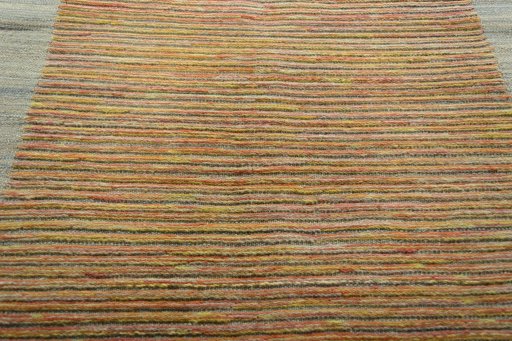 Backside of handmade New Modern Design rug showing knot structure and weave density