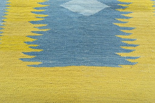 Backside of handmade New Modern Design rug showing knot structure and weave density