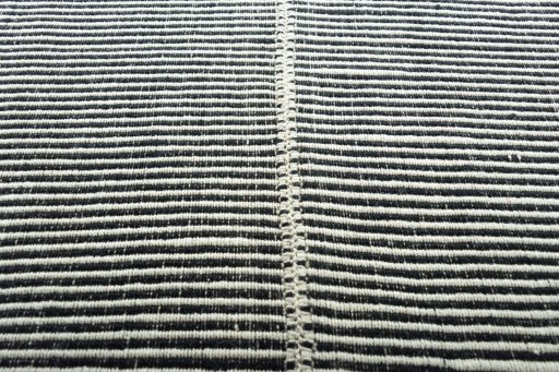 Backside of handmade New Modern Design rug showing knot structure and weave density
