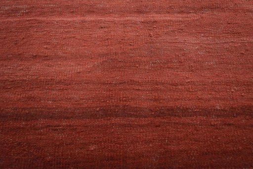 Backside of handmade New Modern Design rug showing knot structure and weave density