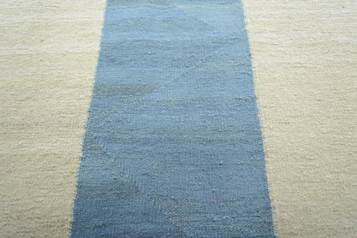 Backside of handmade New Modern Design rug showing knot structure and weave density