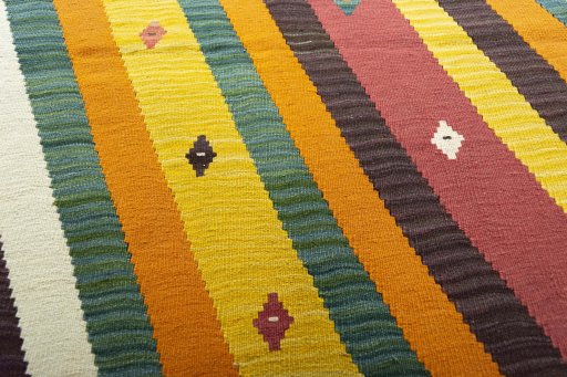Backside of handmade New Modern Design rug showing knot structure and weave density