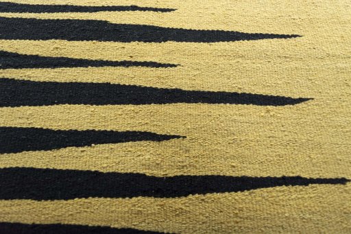 Backside of handmade New Modern Design rug showing knot structure and weave density
