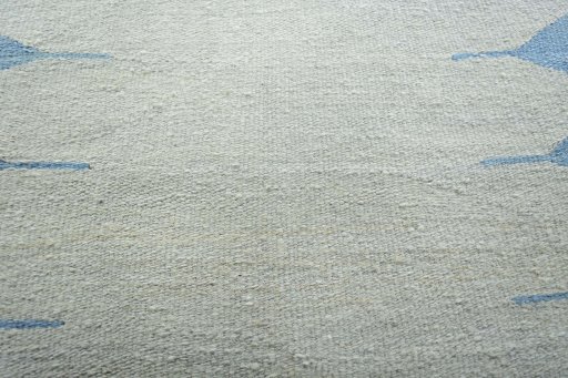 Backside of handmade New Modern Design rug showing knot structure and weave density