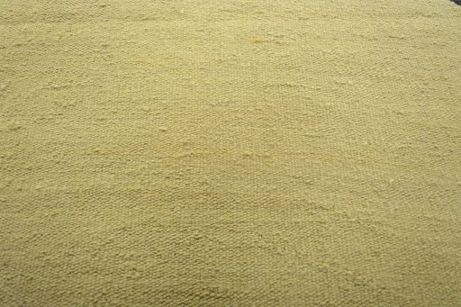 Backside of handmade New Modern Design rug showing knot structure and weave density