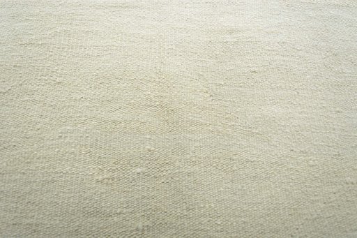 Backside of handmade New Modern Design rug showing knot structure and weave density