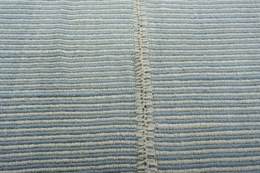 Backside of handmade New Modern Design rug showing knot structure and weave density