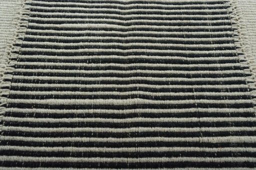 Backside of handmade New Modern Design rug showing knot structure and weave density