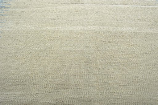 Backside of handmade New Modern Design rug showing knot structure and weave density