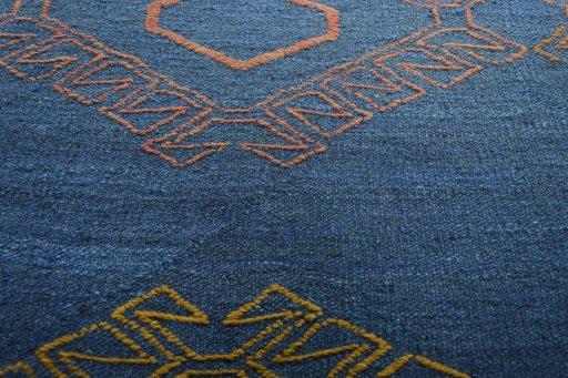 Backside of handmade New Modern Design rug showing knot structure and weave density