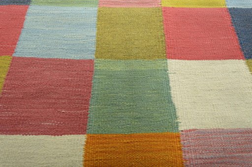 Backside of handmade New Modern Design rug showing knot structure and weave density