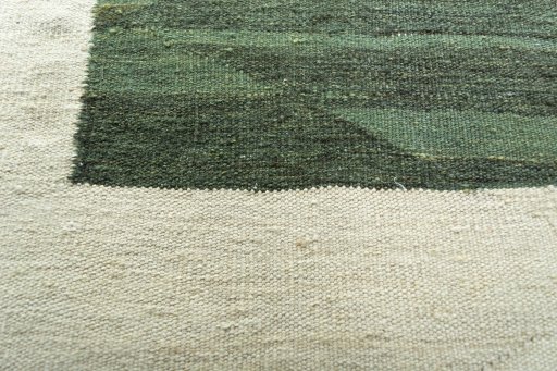 Backside of handmade New Modern Design rug showing knot structure and weave density