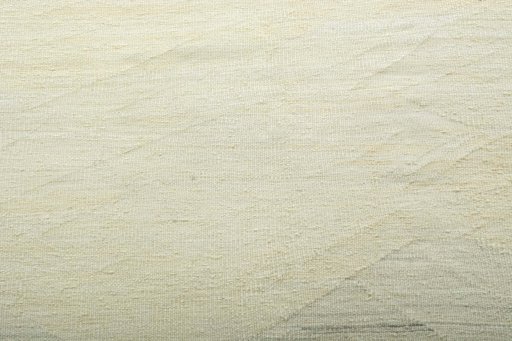 Backside of handmade New Modern Design rug showing knot structure and weave density