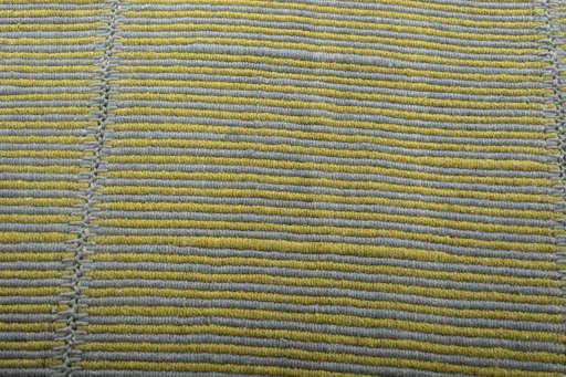 Backside of handmade New Modern Design rug showing knot structure and weave density