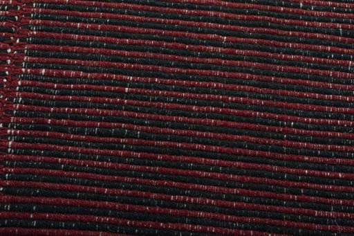Backside of handmade New Modern Design rug showing knot structure and weave density