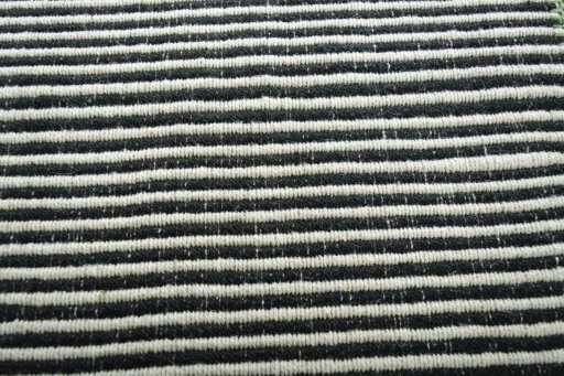 Backside of handmade New Modern Design rug showing knot structure and weave density