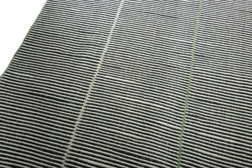 Surface texture of New Modern Design rug with natural Wool and intricate pattern